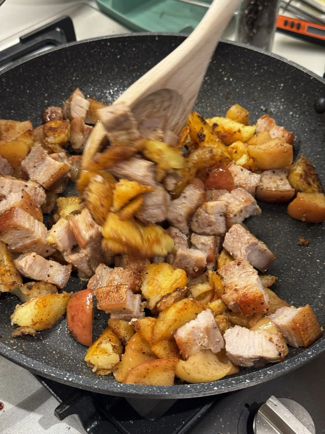 Mixing pork potato and fruit